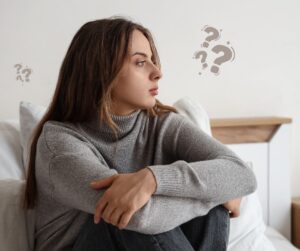 A woman is thinking about making a pregnancy decision.