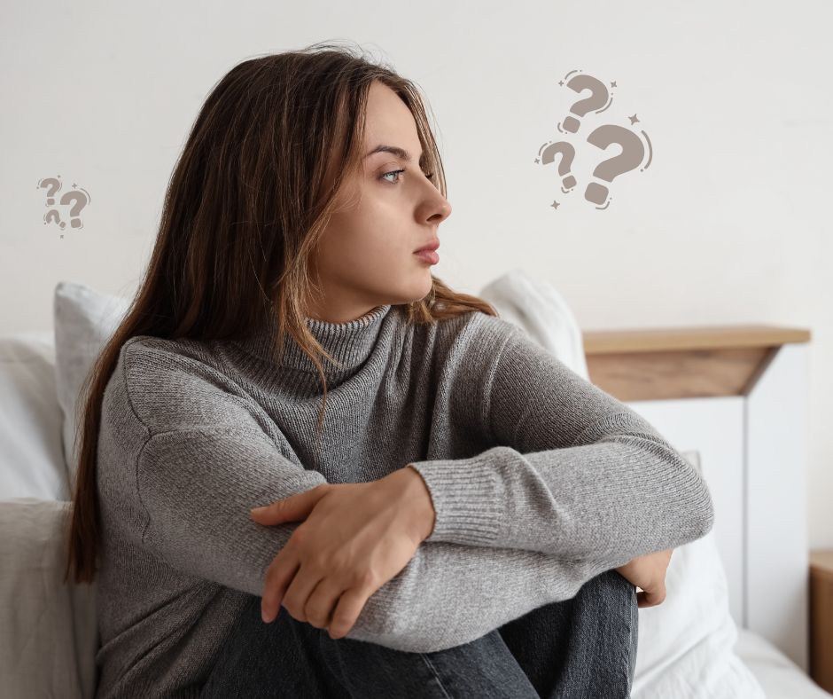 A woman is thinking about making a pregnancy decision.